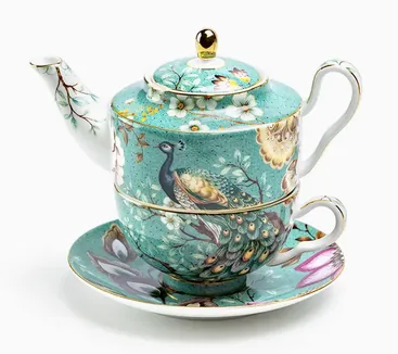Teal tea-for-one set decorated with a peacock, lotus flowers, and gold details.