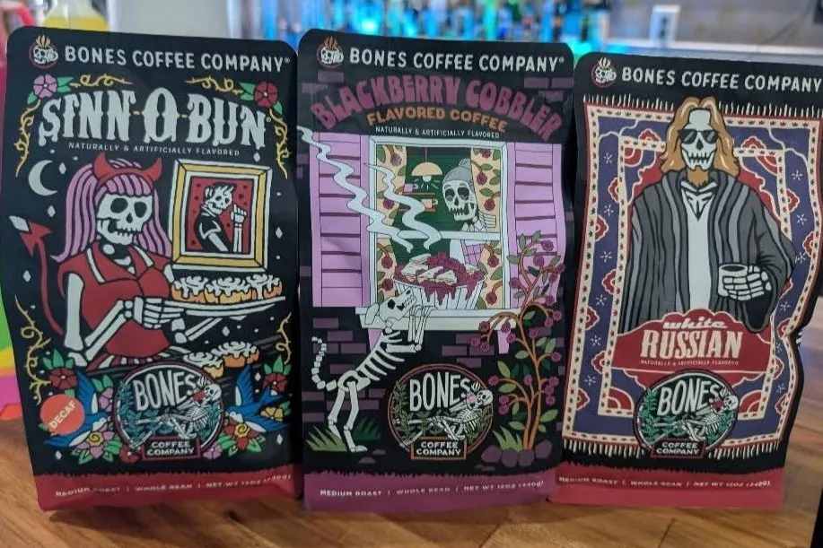 Three Bones Coffee Company bags: Sinn-O-Bun, Blackberry Cobbler, and White Russian.